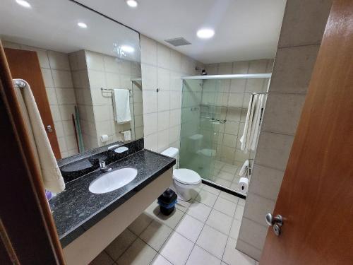 a bathroom with a sink and a toilet and a shower at Flat no Condomínio Metrópolis - Ilha do Leite in Recife