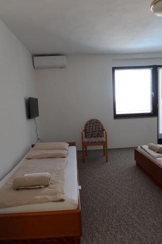 Postel nebo postele na pokoji v ubytování Apartments and Rooms MN, Konjic
