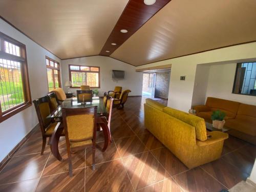 a living room with a couch and a table at Finca La Esperanza in Tibasosa