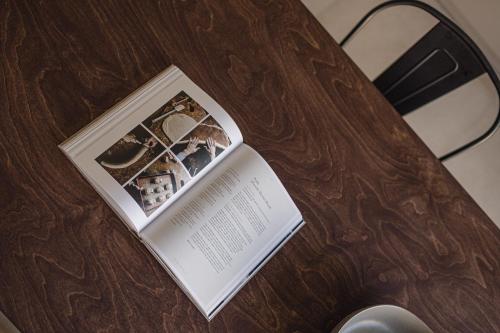 a book sitting on top of a wooden table at Nima Residences in Paleros