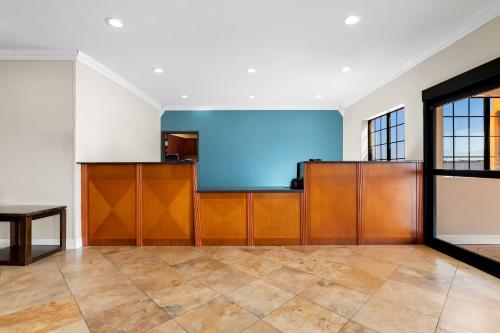 an empty room with a large screen in a building at Quality Inn & Suites McAlester on Hwy 69 in McAlester