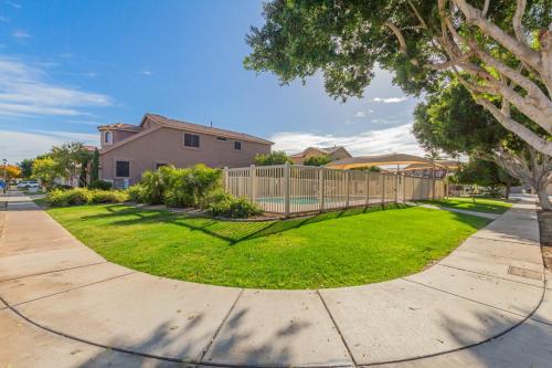 a house with a fence in a yard at San Michelle Luxury Escape -Mesa in Mesa