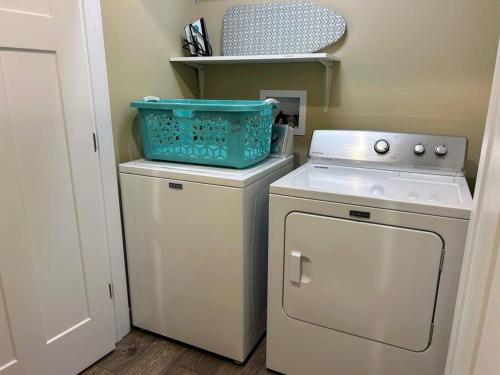 a small kitchen with a stove and a dishwasher at Urban Retreat Downtown Gem Walk Everywhere Train View Mountain View Near National Park Entrance in Bryson City