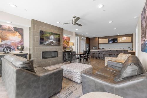 a living room with two couches and a fireplace at Vacation Rentals at Sand Hollow Resort in Hurricane