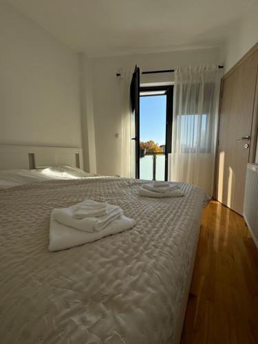 Postel nebo postele na pokoji v ubytování Apartman Petrovic