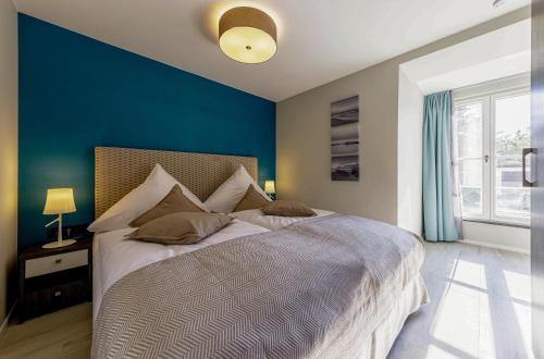Cama o camas de una habitación en Lüttkoje - Ferienwohnung mit zwei Schlafzimmern