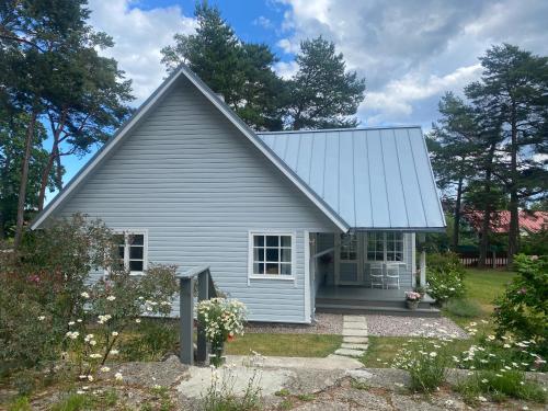 a gray house with a gambrel roof at Villa Kungla in Käsmu