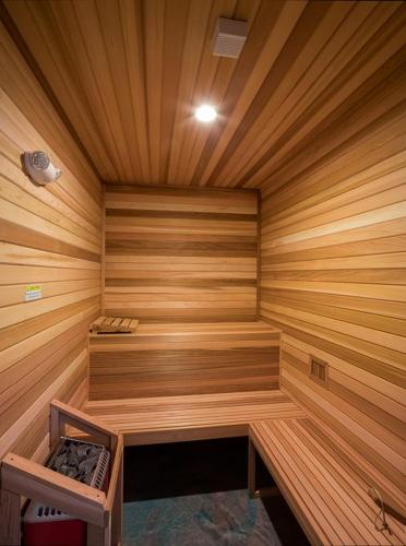 a sauna with wooden walls and a wooden ceiling at Unique Houseboat Rental in Merritt Island