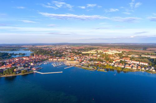 an aerial view of a town on a lake at Kietz-Mole mit Müritzblick in Waren