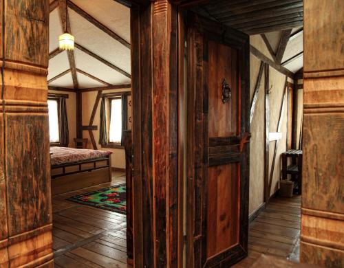 an open door to a bedroom with a bed in a room at Guesthouse Perunov Konak in Belgrade