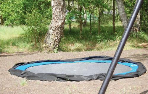 a black and blue cover on a trampoline at Holiday Home Hægvej Grenaa V in Grenå