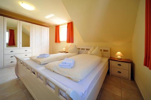 Ένα ή περισσότερα κρεβάτια σε δωμάτιο στο Hus Utblick 8B