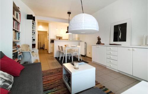 a living room with a couch and a table at Awesome Apartment In Knokke-Heist in Knokke-Heist