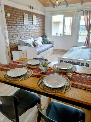 a living room with a table and a couch at FLAMENCOS Apart in Esquel