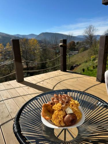 a plate of food on top of a table at Petrick House in Verkhovyna