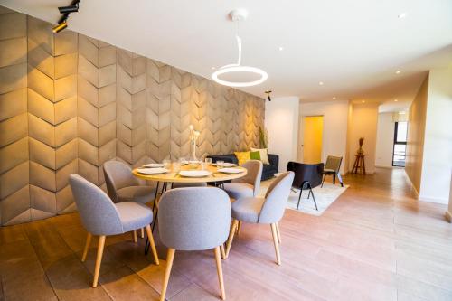 a dining room with a table and chairs at Arezzo Forest View in Quito