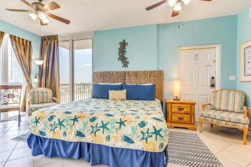 a bedroom with a bed with a blue wall at Vibrant Navarre Condo Pool and Beach Chair Service! in Navarre
