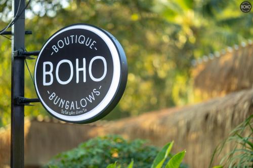 a sign for a botulumulumulumulumulumulumulumulumulumulumulum at BOHO Boutique Bungalows in Baan Tai