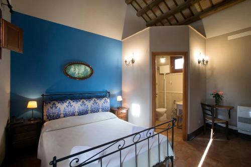 Una cama o camas en una habitación de Agriturismo Don Carlo