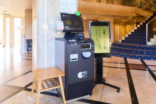 a machine with a television on top of it in a building at Minakuchi Century Hotel - Vacation STAY 35304v in Koka