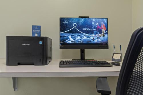 a computer monitor and keyboard on a desk at WorldMark Victoria in Victoria