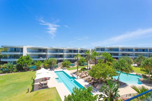 an aerial view of a resort with a swimming pool at Cotton Beach 53 by Kingscliff Accommodation in Casuarina