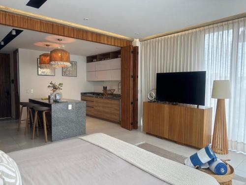 a bedroom with a bed and a television in a room at Mako 54 in Puerto Vallarta