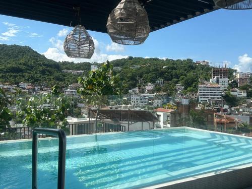a swimming pool on the roof of a building at Mako 54 in Puerto Vallarta