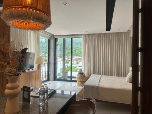 a bedroom with a bed and a desk in a room at Mako 54 in Puerto Vallarta