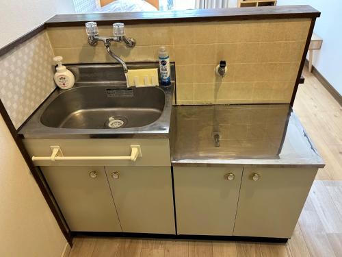 a kitchen with a sink and a counter at Chambord Kyomachi 102,103,108,201,202,205,206,207 - Vacation STAY 19070v in Kumamoto