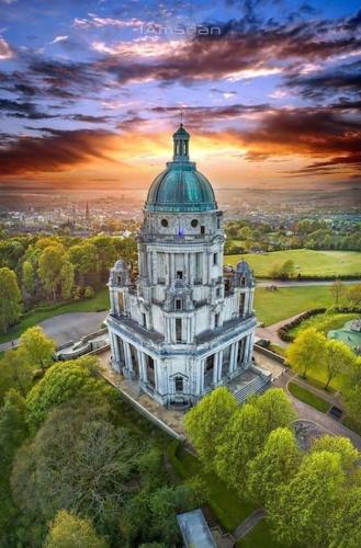 a large white building with a green dome on top at Williamson House Lancaster in Lancaster