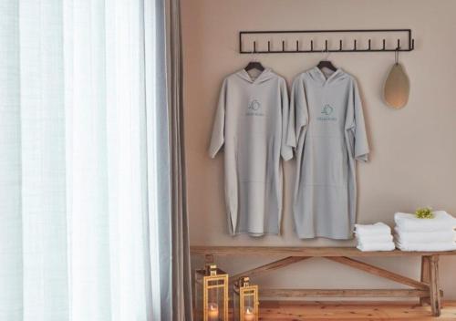 a group of white clothes hanging on a wall at Villa Oloo - Vacation STAY 44072v in Karimata