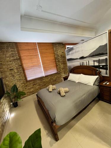 a bedroom with a bed with two stuffed animals on it at IY Loft 5 - Spacious Loft in the Old Town in Valencia