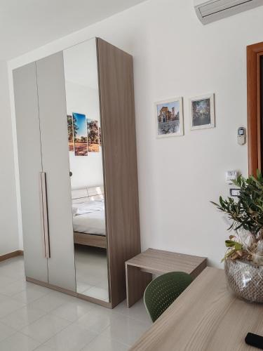 a bedroom with a sliding glass door with a bed at B&B Colli Ameni in Candela