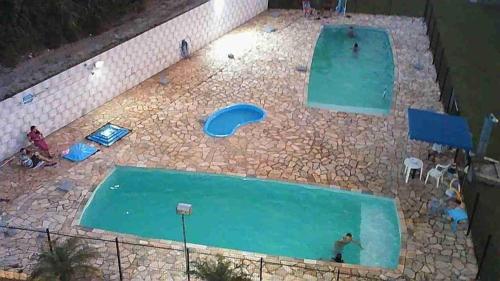an overhead view of an empty swimming pool at Kitnet Flamingo 31B in Matinhos