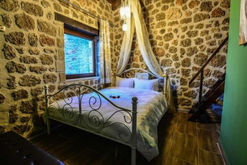 Postel nebo postele na pokoji v ubytování Ξενώνας Σαν Παραμύθι