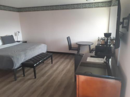 Ένα ή περισσότερα κρεβάτια σε δωμάτιο στο Coast Riders Inn