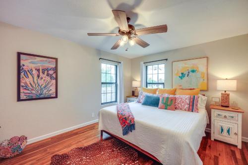 a bedroom with a bed and a ceiling fan at Less Than 1 Mi to Dtwn Home with Fenced Yard in Boerne! in Boerne