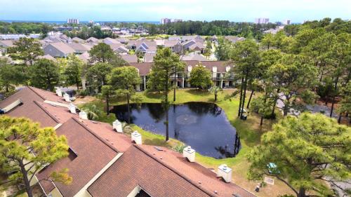 an aerial view of a house with a pond at The Links in Myrtle Beach