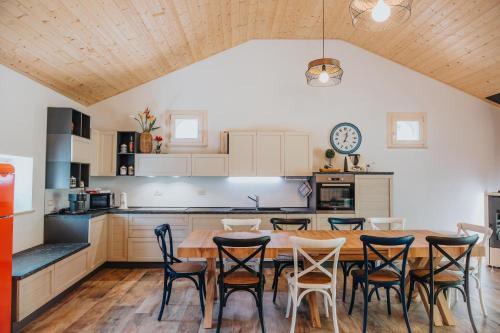 a kitchen with a wooden table and chairs at Agriturismo Angelino - Giazza Ljetzan in Selva di Progno