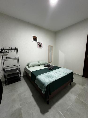 Ένα ή περισσότερα κρεβάτια σε δωμάτιο στο Casa Juza Saquarema