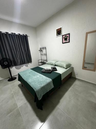 Ένα ή περισσότερα κρεβάτια σε δωμάτιο στο Casa Juza Saquarema
