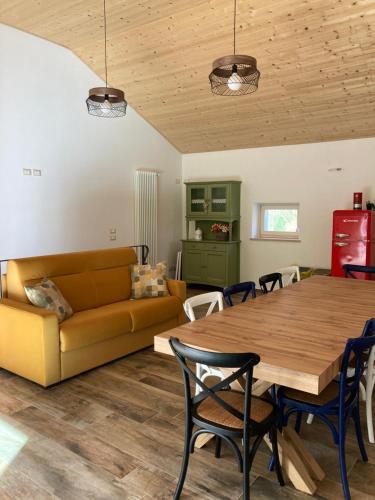 a living room with a couch and a table at Agriturismo Angelino - Giazza Ljetzan in Selva di Progno