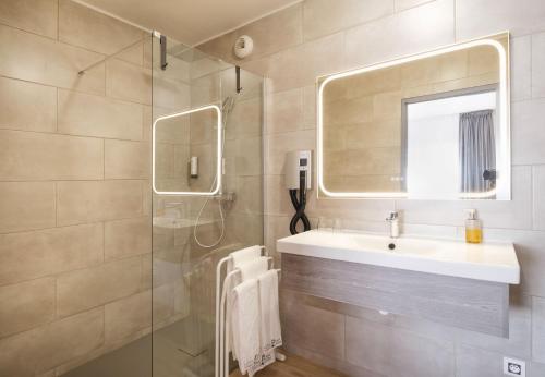 Koupelna v ubytování Hotel Tambourin