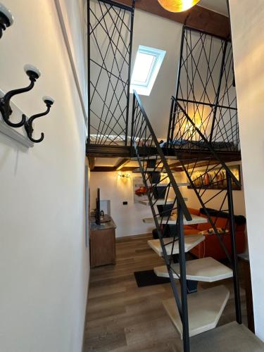 a spiral staircase in a house with a skylight at PERLE d ARCONI in Renče