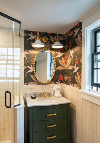 a bathroom with a sink and a mirror at The Hen Houses in Wildwood