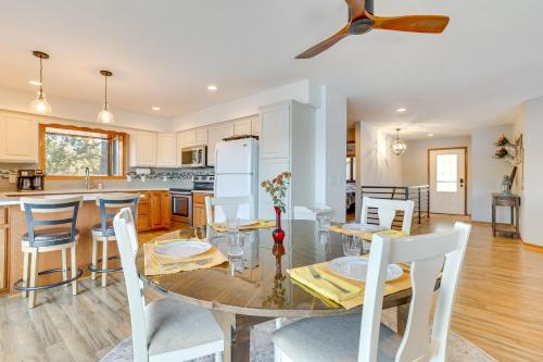 a kitchen and dining room with a table and chairs at Dock and Views Waterfront Home in Wabasha! in Wabasha