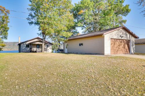 a large yard in front of a garage at Dock and Views Waterfront Home in Wabasha! in Wabasha