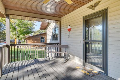 a screened porch with a bench on a house at Dock and Views Waterfront Home in Wabasha! in Wabasha