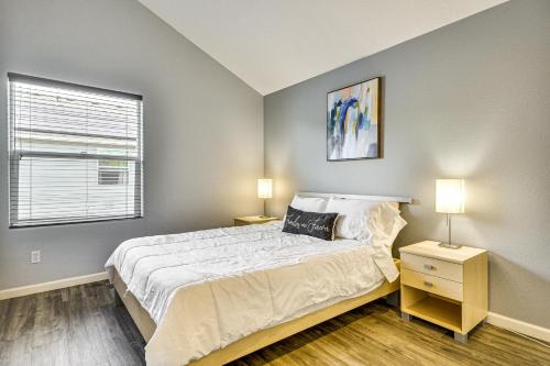a bedroom with a large bed and two lamps at 7 Mi to Dwtn Portland - Home with Patio! in Beaverton